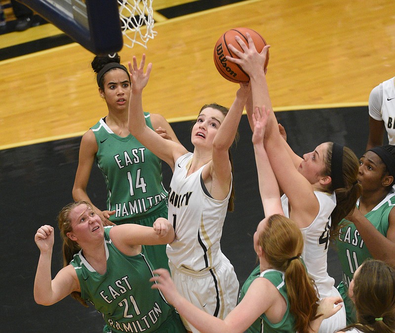 Bradley Central's Halle Hughes and Kailey McRee reach for a rebound in the game against East Hamilton Monday, Feb. 20, 2017 at Soddy-Daisy High School.