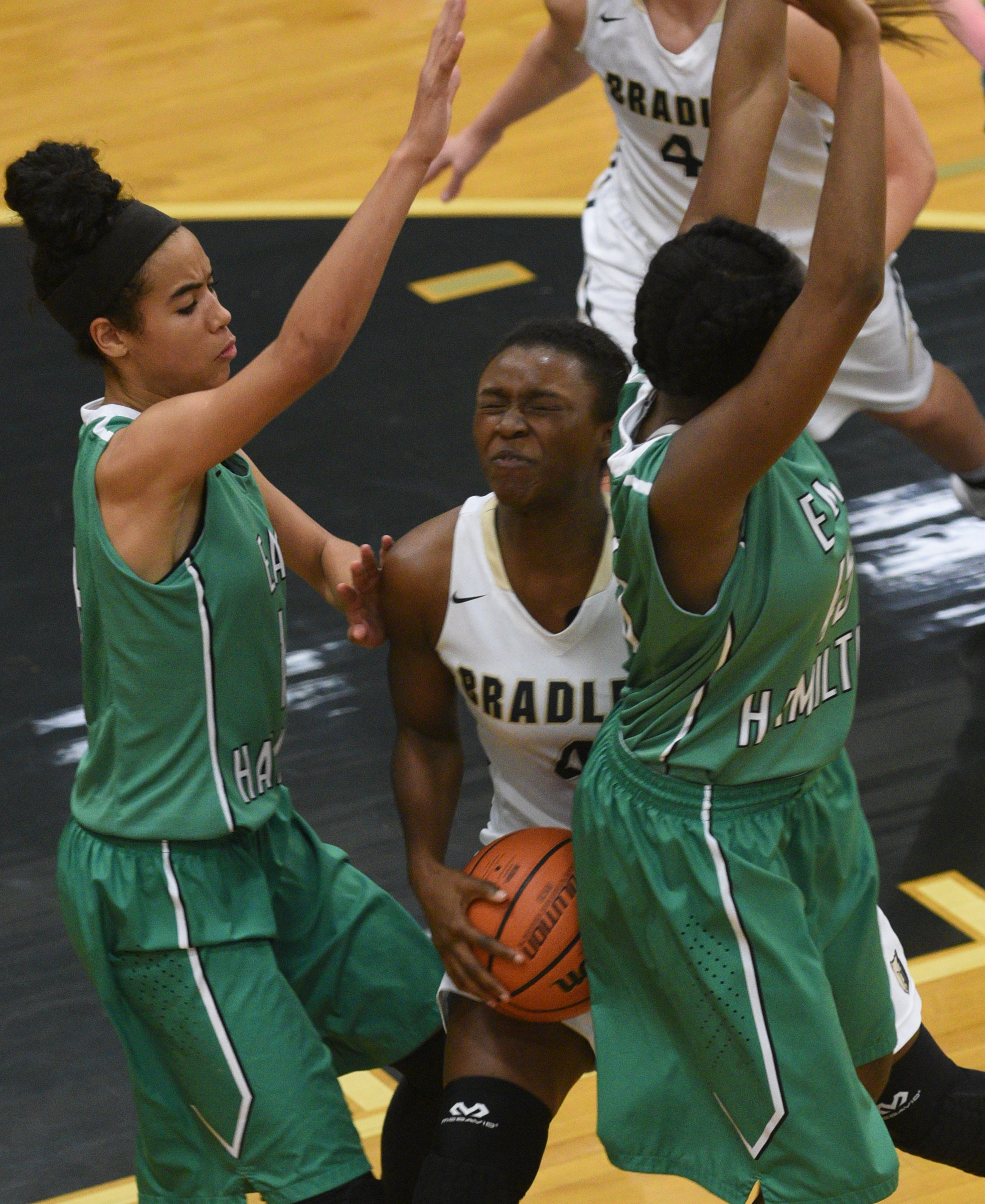 Bradley Central's Kimia Carter is sandwiched between East Hamilton's Madison Hayes, left, and Eliziah LaBoo Monday, Feb. 20, 2017 at Soddy-Daisy High School.