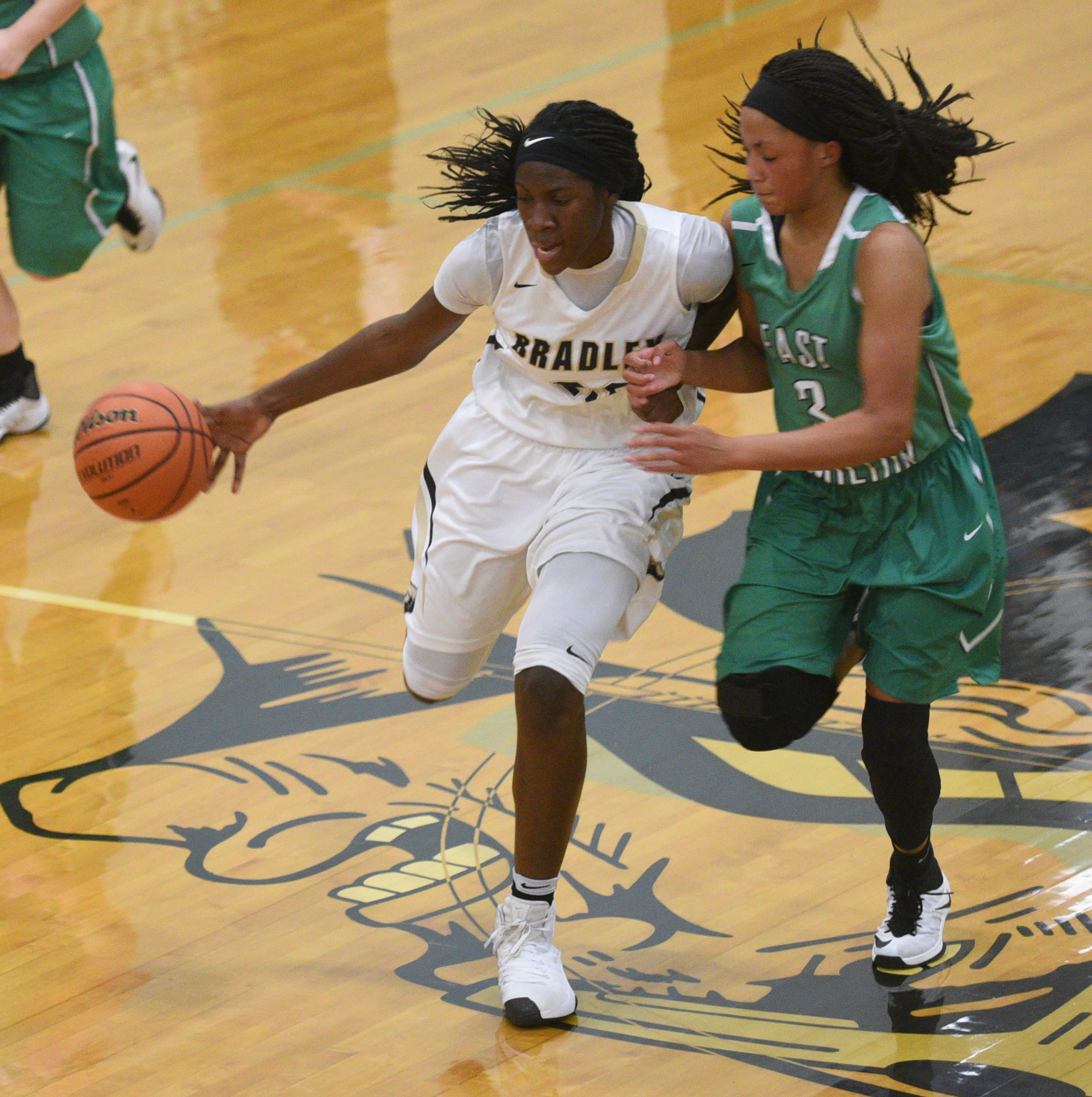 Bradley Central's Rhyne Howard is fouled by East Hamilton's Dezah Lacy Monday, Feb. 20, 2017 at Soddy-Daisy High School.