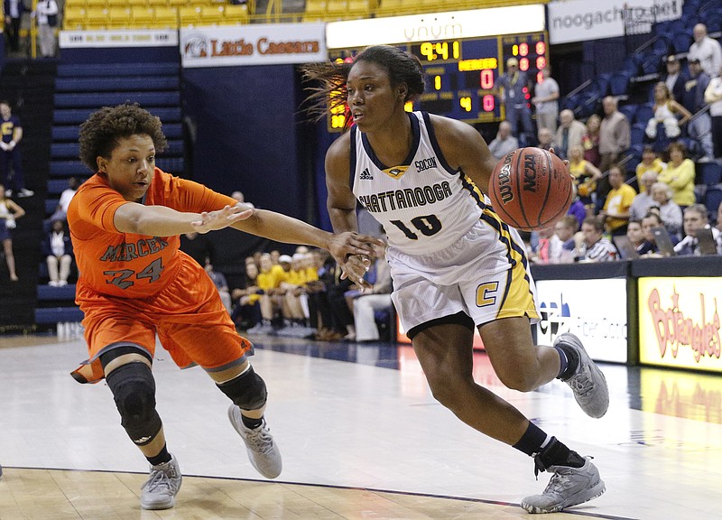 UTC guard Queen Alford dribbles around Mercer guard Kahlia Lawrence during the Lady Mocs' home basketball game against the Mercer Bears at McKenzie Arena on Thursday, Feb. 2, 2017, in Chattanooga, Tenn.