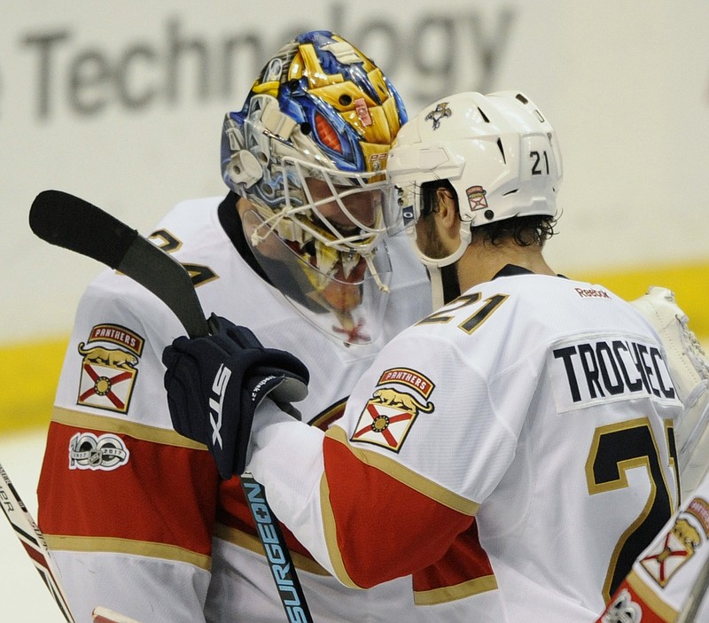 
              Florida Panthers' goalie James Reimer, left, is congratulated by teammate Vincent Trochck (21) after their 2-1 victory over the St. Louis Blues in an NHL hockey game, Monday, Feb. 20, 2017, in St. Louis. (AP Photo/Bill Boyce)
            