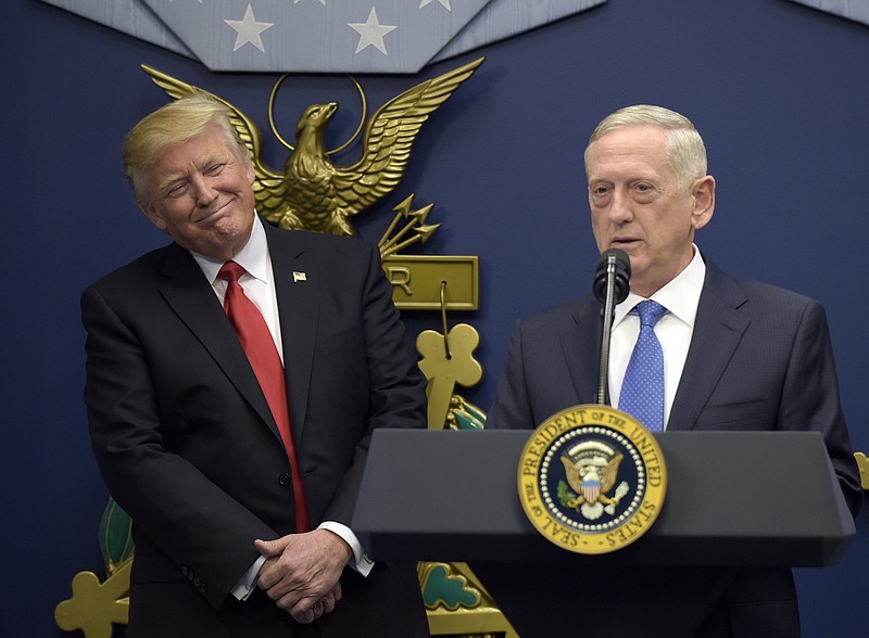 
              In this Jan. 27, 2017 photo, President Donald Trump, left, listens as Defense Secretary James Mattis, right, speaks at the Pentagon in Washington. With Republicans in charge of Congress, President Donald Trump’s pledge to boost the Pentagon’s budget by tens of billions of dollars should be a sure bet. It’s not.  (AP Photo/Susan Walsh)
            