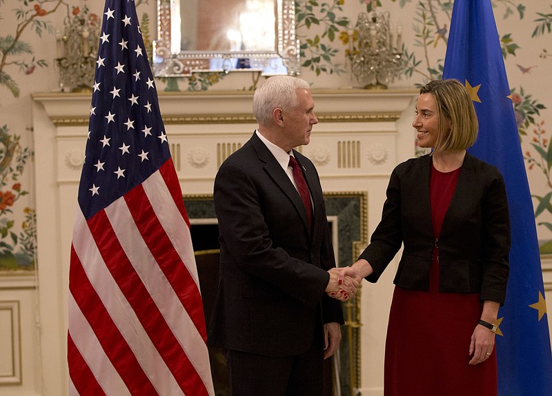 
              United States Vice President Mike Pence, left, shakes hands with European Union High Representative Federica Mogherini during a meeting at US ambassadors residence in Brussels on Monday, Feb. 20, 2017. U.S. Vice President Pence is currently on a two-day visit to meet with EU and NATO officials. (AP Photo/Virginia Mayo, Pool)
            