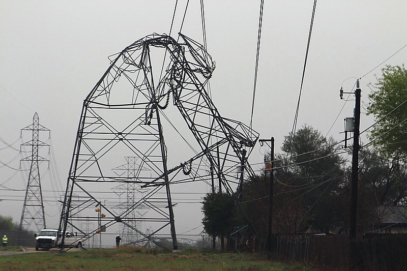 
              A CPS Energy transmission tower is bent in half Monday, Feb. 20, 2017, in San Antonio. Severe storms pushed at least two tornadoes through parts of San Antonio overnight, ripping the roofs off homes and damaging dozens of other houses and apartments yet causing only minor injuries, authorities said Monday. (Tyler White/The San Antonio Express-News via AP)
            