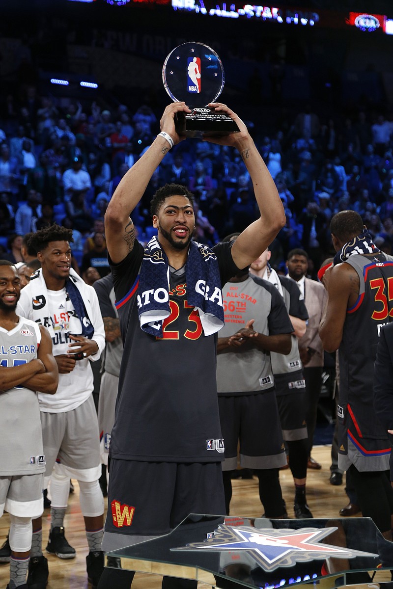 
              Western Conference forward Anthony Davis of the New Orleans Pelicans (23 ) holds up his MVP trophy after the NBA All-Star basketball game in New Orleans, Sunday, Feb. 19, 2017. (AP Photo/Max Becherer)
            