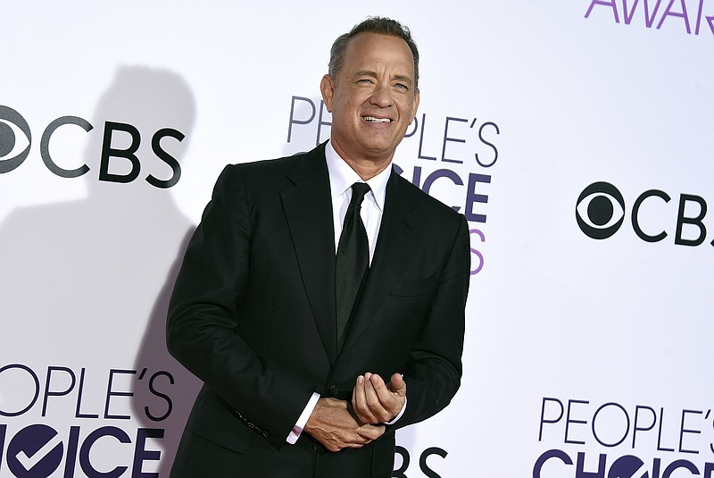 
              FILE - In this Wednesday, Jan. 18, 2017, file photo, Tom Hanks arrives at the People's Choice Awards at the Microsoft Theater in Los Angeles. The Oscar-winning actor’s first book, “UNCOMMON TYPE: Some Stories,” features 17 stories, each in some way involving a different typewriter. It’s due out Oct. 24, 2017, from Alfred A. Knopf. (Photo by Jordan Strauss/Invision/AP, File)
            