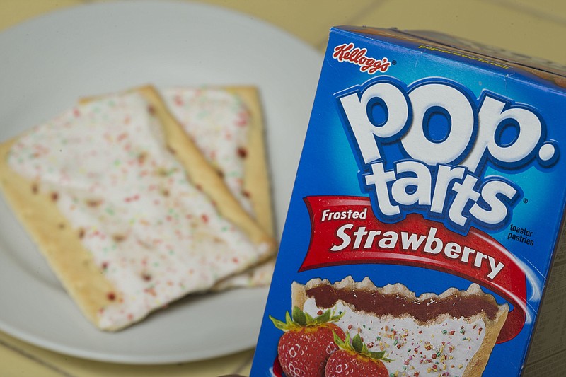 
              FILE - In this Monday, April 29, 2013, file photo, Kellogg's brand Strawberry flavored Pop-Tarts are arranged for a photo in Surfside, Fla. Kellogg's transformed its New York City restaurant into a Pop--Tarts Cafe for several days beginning Feb. 21, 2017. (AP Photo/Wilfredo Lee, File)
            