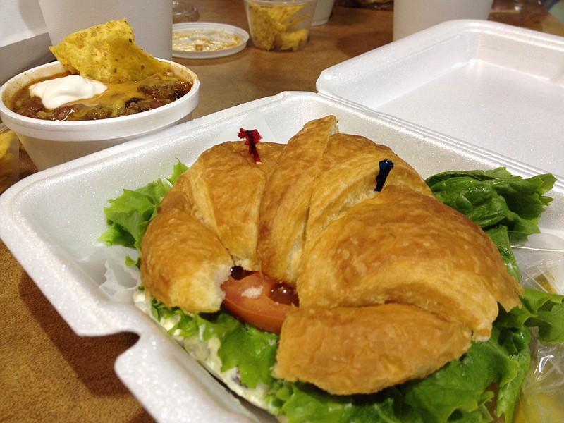 The Chicken Salad Sandwich at Cloud 9 Cafe & Desserts at Eastgate Town Center is served on a buttery croissant with the option of lettuce and tomato. It's halved for easier handling. The Taco Soup, one of six soups du jour, comes with sour cream and nacho chips.