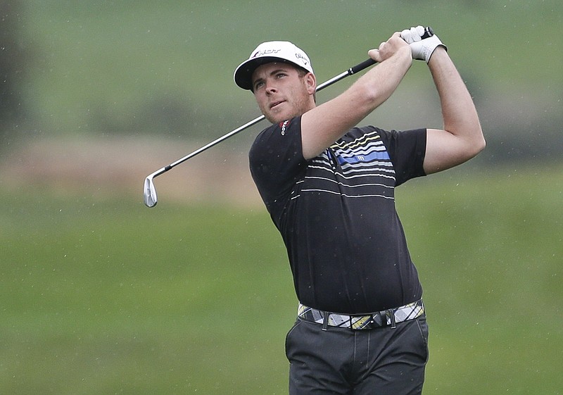 Luke List watches a shot on the second hole on the South Course at Torrey Pines during the second round of the Farmers Insurance Open golf tournament Friday, Jan. 25, 2013, in San Diego. (AP Photo/Lenny Ignelzi)
