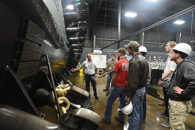 Staff File Photo by Angela Lewis Foster Manager of inside sales, Steve Pack, talks to Ridgeland High School students as they toured Astec Industries subdiary Astec Inc. last year.