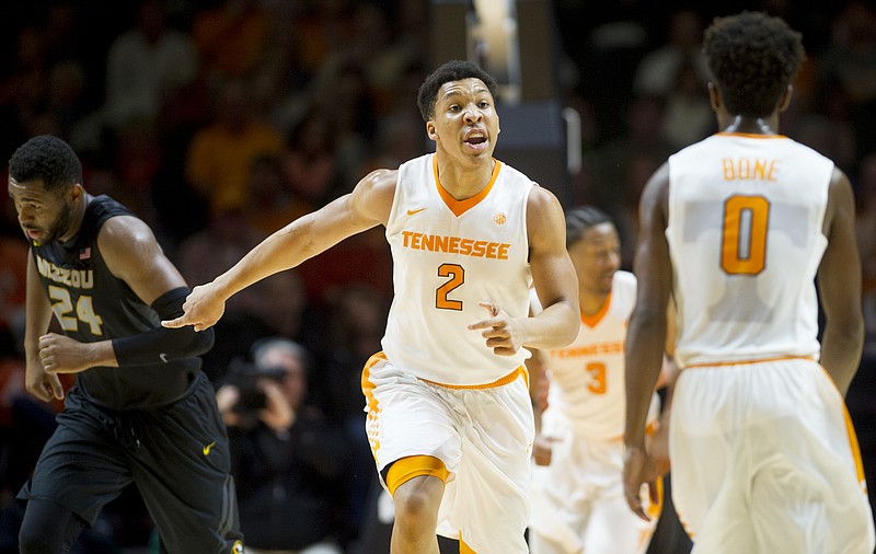 Tennessee's Grant Williams (2) calls to teammate Jordan Bone (0) during an NCAA college basketball game against Missouri at Thompson-Boling Arena in Knoxville, Tenn., on Saturday, Feb 18, 2017. Tennessee won 90-70. (Calvin Mattheis/Knoxville News Sentinel via AP)