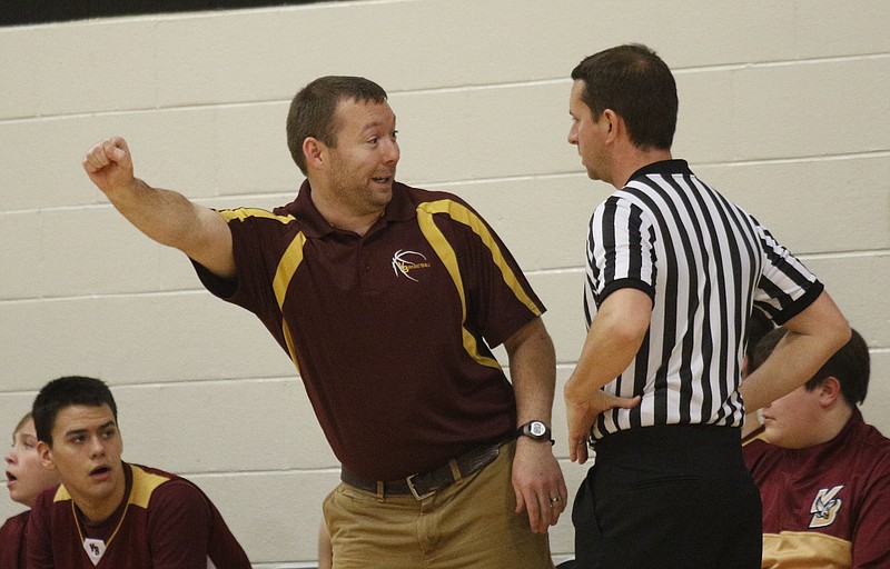 Van Buren County boys basketball coach Dustin Sullivan argues a call with an official during their high school basketball game Friday, Jan. 9, 2015, at Lookout Valley High School in Chattanooga, Tenn.