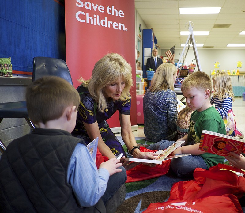 
              In this Feb. 15, 2017 photo provided by Save the Children, Dr. Jill Biden speaks with students Gus Mathis, right, and Cole Swindle, during Biden's visit with Save the Children at Linden Elementary School in Linden, Tenn. Biden, educator and wife of former Vice President Joe Biden, was named board chair of Save the Children, which focuses on the health, education and safety of kids, announced Tuesday, Feb. 21, 2017. (Shawn Millsaps/Save the Children via AP)
            
