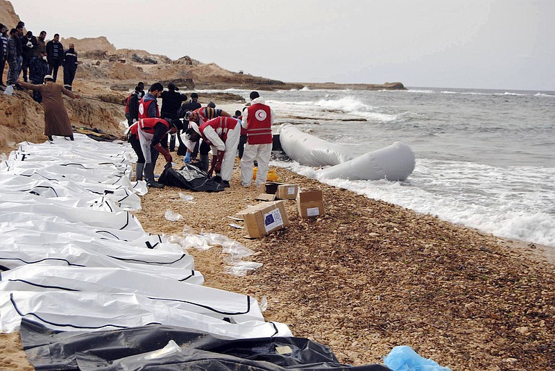 
              This Monday, Feb. 20, 2017 photo provided by The International Federation of Red Cross and Red Crescent Societies (IFRC), shows the bodies of people that washed ashore and were recovered by the Libyan Red Crescent, near Zawiya, Libya. The Libyan Red Crescent says at least 74 bodies of African migrants have washed ashore in western Libya, the latest tragedy at sea along a perilous trafficking route to Europe. It says the bodies were found on Monday, and that more may yet surface. (Mohannad Karima/IFRC via AP)
            