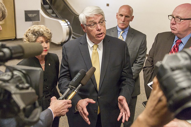 
              Williamson County Mayor Rogers Anderson speaks to reporters at the legislative office complex in Nashville, Tenn., on Tuesday, Feb. 21, 2017. Behind him, from left to right, are Clarksville Mayor Kim McMillan, Sumner County Executive Anthony Holt and Robertson County Mayor Howard Bradley. The mayors are supporting Gov. Bill Haslam's proposal to allow local governments to hold tax referendums to pay for transit projects. (AP Photo/Erik Schelzig)
            