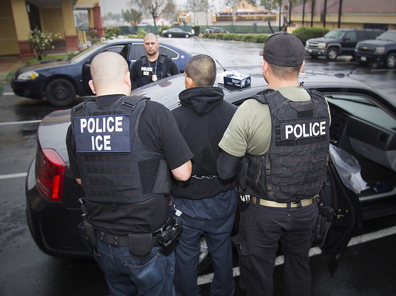 
              In this photo taken Feb. 7, 2017, released by U.S. Immigration and Customs Enforcement, an arrest is made during a targeted enforcement operation conducted by U.S. Immigration and Customs Enforcement (ICE) aimed at immigration fugitives, re-entrants and at-large criminal aliens in Los Angeles. The Trump administration is wholesale rewriting the U.S. immigration enforcement priorities, broadly expanding the number of immigrants living in the U.S. illegally who are priorities for deportation, according to a pair of enforcement memos released Tuesday, Feb. 21, 2017.  (Charles Reed/U.S. Immigration and Customs Enforcement via AP)
            