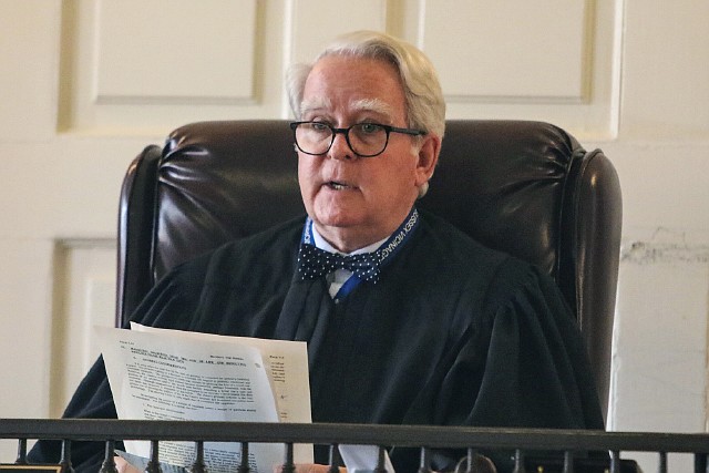 
              In this Nov. 21, 2016 photo Superior Court Judge Paul Armstrong issues his ruling on whether Ashley G., a Greystone Park Psychiatric Hospital patient currently at Morristown Medical Center, can refuse forced feeding. The anorexic and bulimic New Jersey woman who petitioned the court to refuse force-feeding has died three months after Armstrong granted her request. Her court-appointed lawyer, Edward D'Alessandro Jr., told the Daily Record of Parsippany  the 30-year-old identified died Monday, Feb. 20, 2017, at Morristown Medical Center's palliative care unit.  (Alexandra Pais /The Daily Record via AP)
            