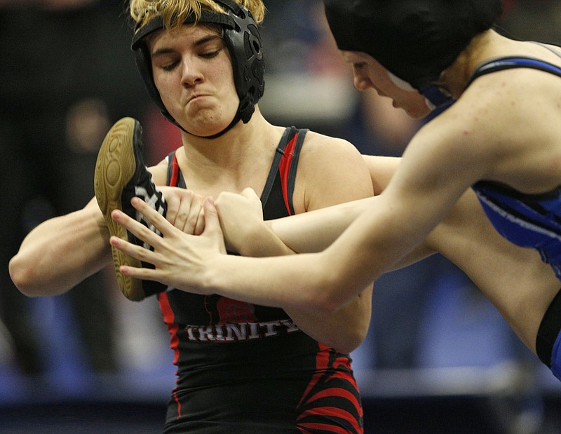 
              In this Feb. 18, 2017 photo, Euless Trinity's Mack Beggs, left, wrestles Grand Prairie's Kailyn Clay during the finals of the UIL Region 2-6A wrestling tournament at Allen High School in Allen, Texas.   Beggs, who is transgender, is transitioning from female to male, won the girls regional championship after a female opponent forfeited the match. (Nathan Hunsinger/The Dallas Morning News via AP)
            