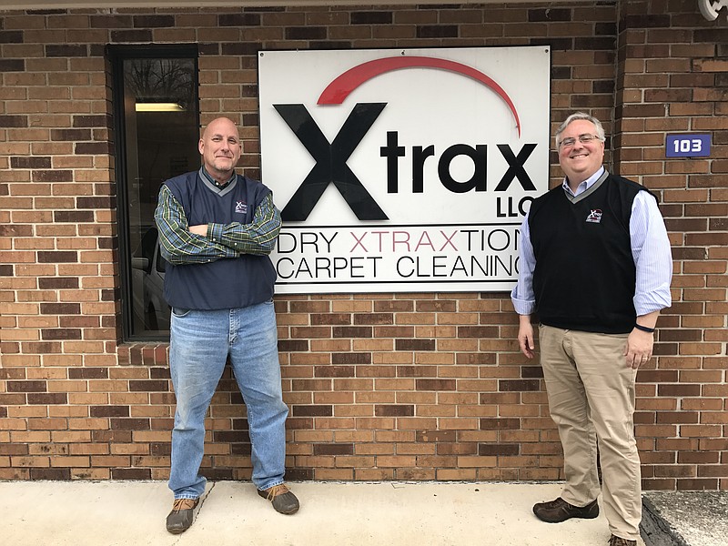 Xtrax Operations Manager Keith Collins, left, and owner Chris Ackerman stand in front of the business, located on Signal Mountain Road.