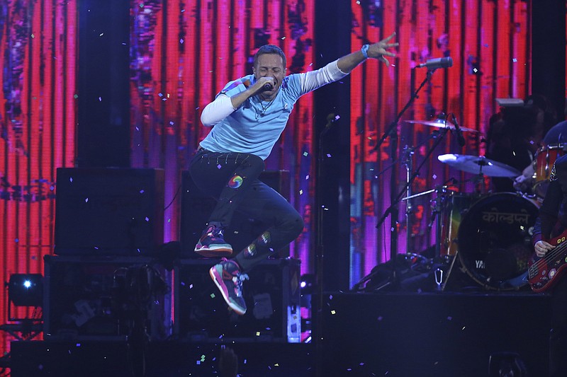 Singer Chris Martin performs on stage at the Brit Awards 2017 in London, Wednesday, Feb. 22, 2017. (Photo by Joel Ryan/Invision/AP)