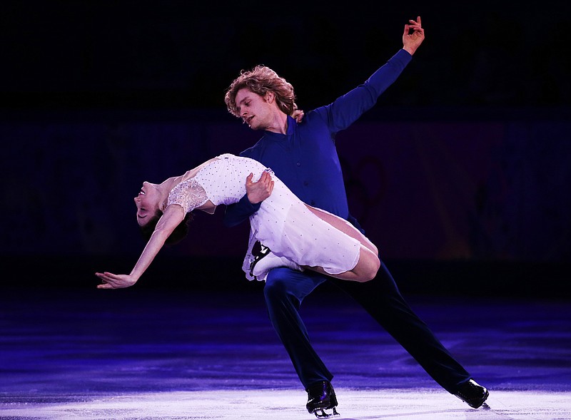 
              FILE - In this Feb. 22, 2014 file photo, Meryl Davis and Charlie White of the United States perform during the figure skating exhibition gala at the Iceberg Skating Palace during the 2014 Winter Olympics in Sochi, Russia.  Davis and  White won't be defending their Olympic ice dance gold medal in South Korea, but they're confident they are leaving U.S. chances in good hands (AP Photo/Bernat Armangue)
            