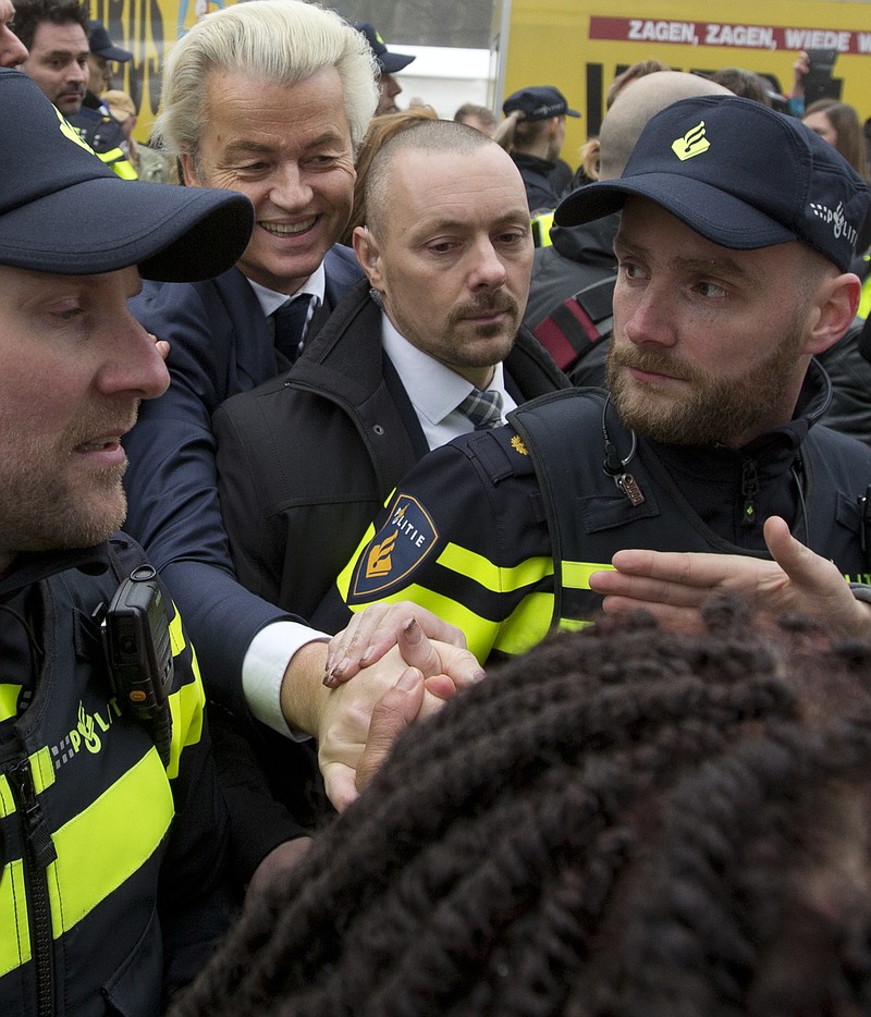 
              Firebrand int-islam lawmaker Geert Wilders greets well-wishers during an election campaign stop in Spijkenisse, near Rotterdam, Netherlands Saturday Feb. 18, 2017. Now, as a March 15 parliamentary election looms, the political mood is turning inward as Wilders dominates polls with an isolationist manifesto that calls for the Netherlands "to be independent again. So out of the EU." (AP Photo/Peter Dejong)
            