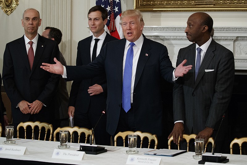 
              President Donald Trump welcomes manufacturing executives to a meeting at the White House in Washington, Thursday, Feb. 23, 2017. From left are, Archer Daniels Midland CEO Juan Luciano, White House Senior Adviser Jared Kushner, Trump, and Merck CEO Kenneth Frazier. (AP Photo/Evan Vucci)
            