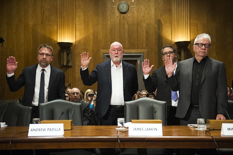 FILE - In this Jan. 10, 2017 file photo from left, Backpage.com CEO Carl Ferrer, former owner James Larkin, COO Andrew Padilla, and former owner Michael Lacey, are sworn-in on Capitol Hill in Washington, prior to testifying before the Senate Homeland Security and Governmental Affairs subcommittee hearing into Backpage.com's alleged facilitation of online sex trafficking. Ferrer, Lacy and Larkin appeared in Sacramento Superior Court Tuesday, Jan. 24 to face renewed charges that include pimping, conspiracy and money laundering. (AP Photo/Cliff Owen, File)