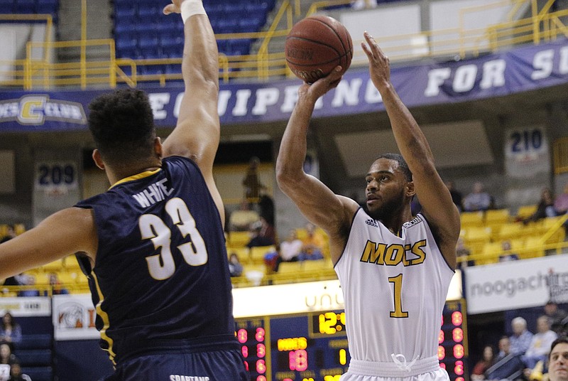 UTC guard Greg Pryor shoots a 3 over UNCG center R.J. White during the Mocs' home basketball game against the UNCG Spartans at McKenzie Arena on Thursday, Feb. 2, 2017, in Chattanooga, Tenn.