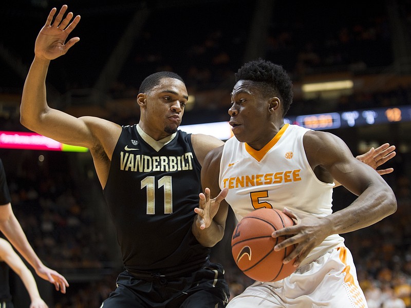 Tennessee's Admiral Schofield drives past Vanderbilt's Jeff Roberson during the first half of Wednesday night's game in Knoxville. Vanderbilt led 18-4 in the first half on the way to a 67-56 win.