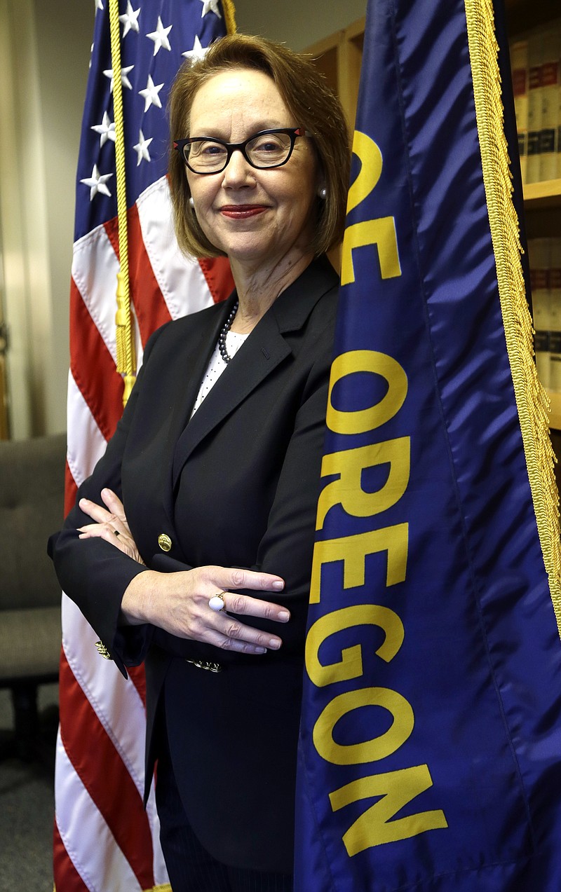 
              FILE - In this July 13, 2016 file photo, Oregon Attorney General Ellen Rosenblum poses for a photo at her office in Portland, Ore. Rosenblum has staffers strategizing how to fight back if the federal government tries to withhold funds to force compliance with conservative policies, like on abortion. (AP Photo/Don Ryan, file)
            