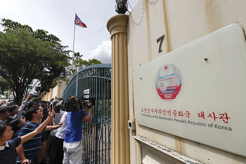 
              Journalists wait outside North Korean Embassy in Kuala Lumpur, Malaysia, Wednesday, Feb. 22, 2017. The women suspected of fatally poisoning a scion of North Korea's ruling family were trained to coat their hands with toxic chemicals then wipe them on his face, police said Wednesday, announcing they were now seeking a North Korean diplomat in connection with the attack. (AP Photo/Vincent Thian)
            
