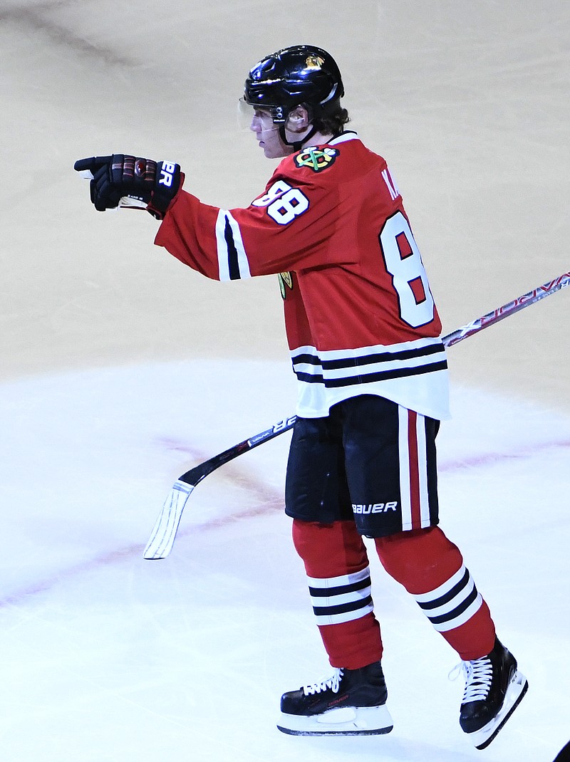 
              Chicago Blackhawks right wing Patrick Kane (88) reacts after scoring a goal against the Arizona Coyotes during the second period of an NHL hockey game Thursday, Feb. 23, 2017, in Chicago. (AP Photo/David Banks)
            