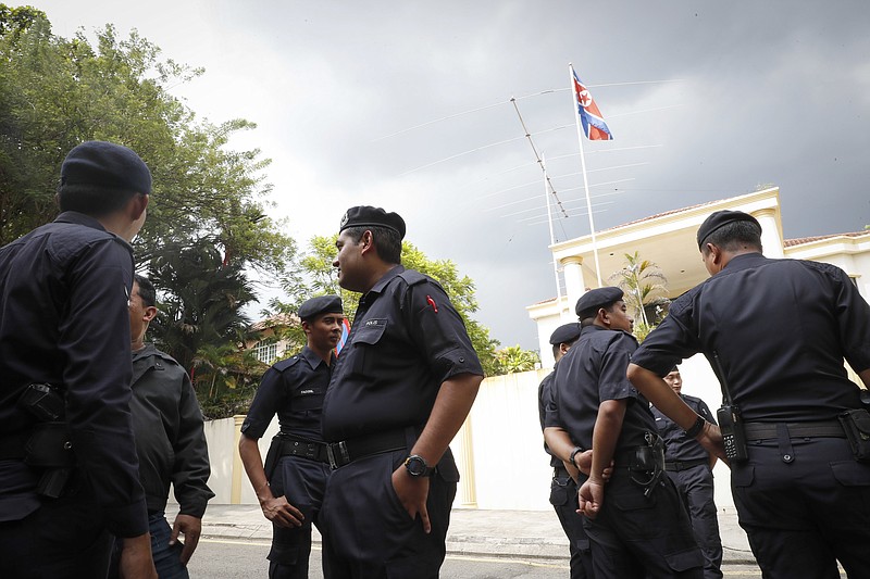 
              Malaysian Police stand outside North Korean Embassy in Kuala Lumpur, Malaysia, Thursday, Feb. 23, 2017. North Korea denied Thursday that its agents masterminded the assassination of the half brother of leader Kim Jong Un, saying a Malaysian investigation into the death of one of its nationals is full of "holes and contradictions." (AP Photo/Vincent Thian)
            