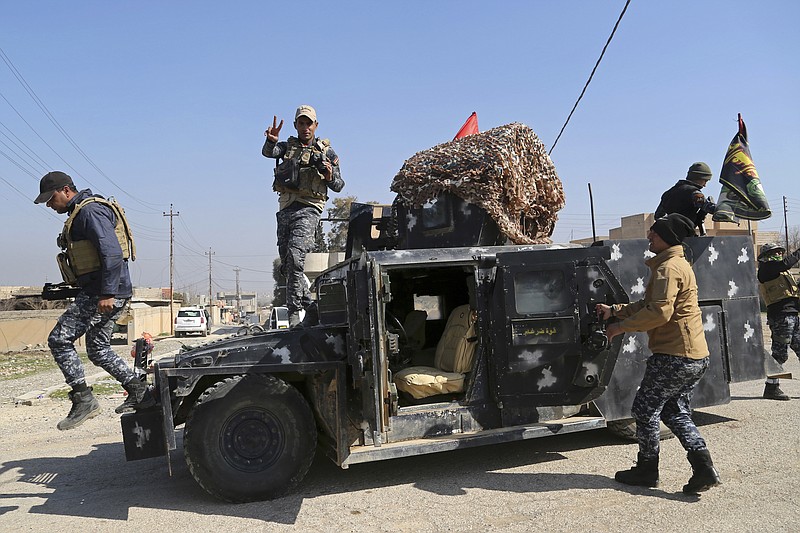 
              Iraqi Federal police deploy after regaining control of the town of Abu Saif, west of Mosul, Iraq, Wednesday, Feb. 22, 2017. Iraq's government-sanctioned paramilitary forces, made up mainly of Shiite militiamen, have launched a new push to capture villages west of the city of Mosul from Islamic State militants.(AP Photo/Khalid Mohammed)
            
