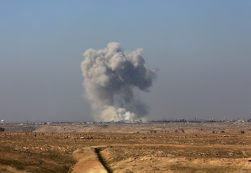 
              Smoke rises from the western side of Mosul following a U.S.-led coalition airstrike, in Abu Saif, outside the western side of Mosul, Iraq, Wednesday, Feb. 22, 2017. (AP Photo/ Khalid Mohammed)
            