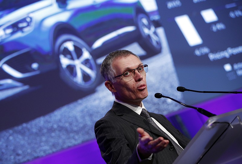 
              PSA Peugeot Citroen Chief Executive Carlos Tavares delivers his speech during the presentation of the company's 2016 full year results, in Paris, Thursday, Feb.23, 2017. French carmaker PSA Group saw its profits jump last year and is giving dividends for the first time since 2011, burnishing its image as it weighs a buyout of General Motors' money-losing European operations. (AP Photo/Christophe Ena)
            