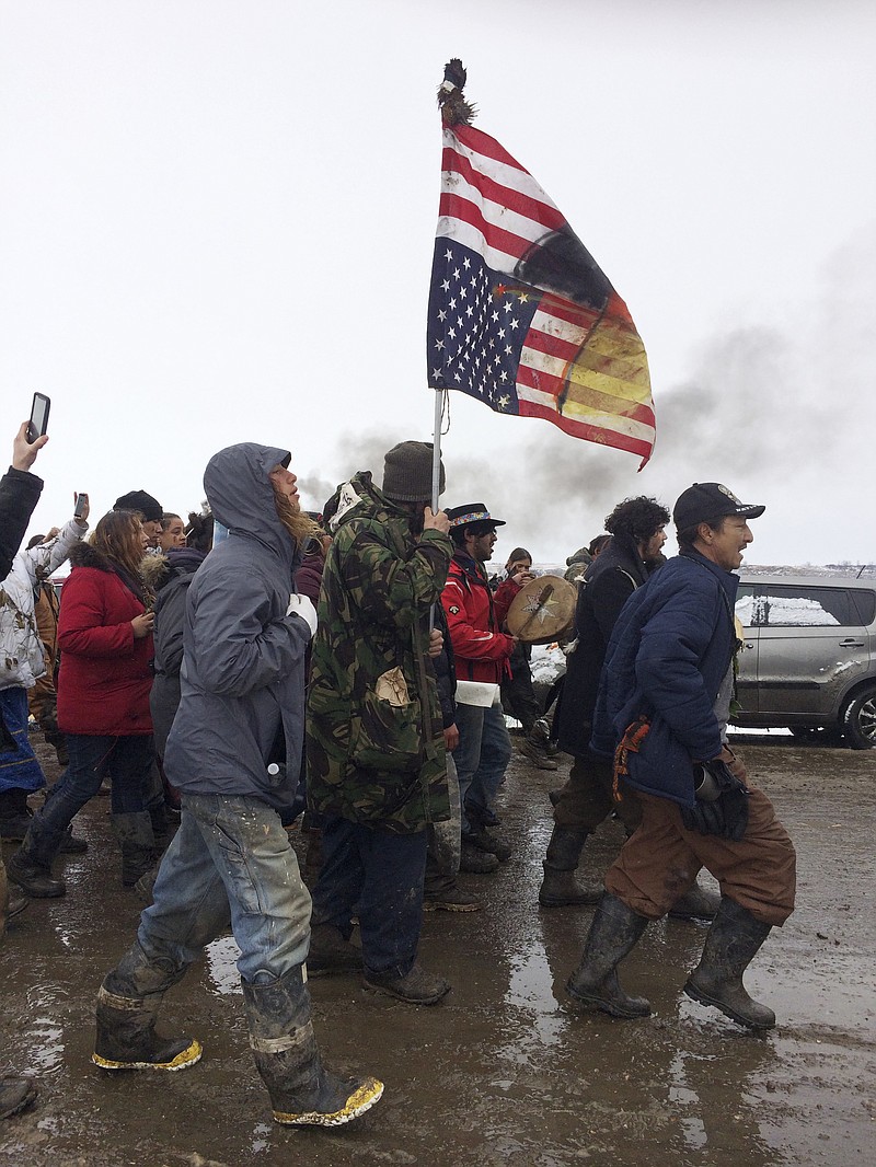 
              People peacefully leave the Dakota Access pipeline main protest camp near Cannon Ball, N.D., as authorities prepare to shut it down in advance of the spring flooding season. The Army Corps of Engineers ordered the camp closed at 2 p.m. Wednesday. (AP Photo/Blake Nicholson)
            