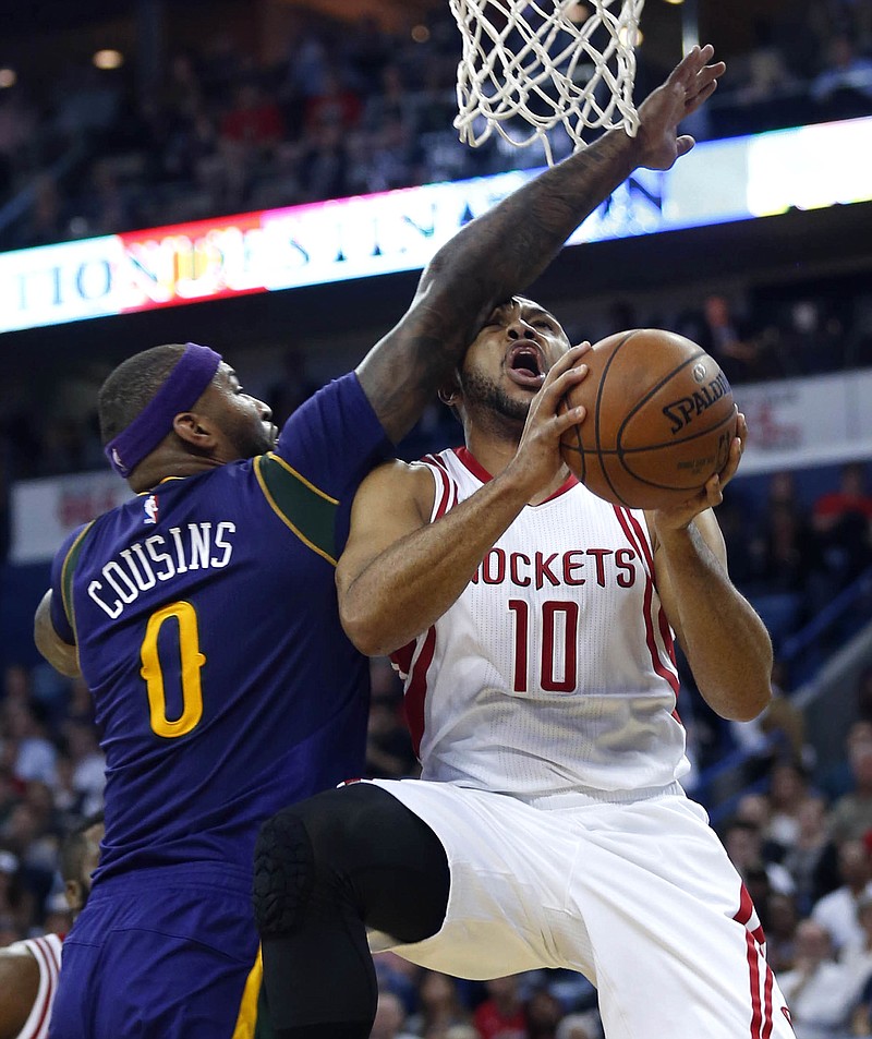 
              Houston Rockets guard Eric Gordon (10) goes to the basket against New Orleans Pelicans forward DeMarcus Cousins (0) during the first half of an NBA basketball game in New Orleans, Thursday, Feb. 23, 2017. (AP Photo/Gerald Herbert)
            