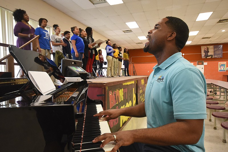 At Tyner Middle School Thursday, Marcellus Barnes, who started the Unity Performing Arts Foundation of Chattanooga, leads a choir practice for Saturday's Unity Praise Celebration concert to be held at Bayside Baptist Church.