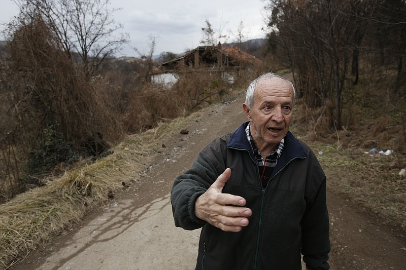 
              Local man Islet Delibasic talks to journalists after a landslide near the Bosnian town of Kakanj , 50 kms north of Sarajevo on Friday, Feb. 24, 2017. More than 150 people have been evacuated from their homes in central Bosnia due to a major landslide at the nearby open pit coal mine that has threatened to bury their villages. ( AP Photo/Amel Emric)
            