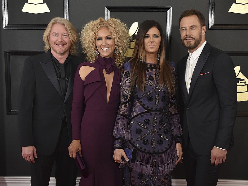 
              FILE - This Feb. 12, 2017 file photo shows Philip Sweet, from left, Kimberly Schlapman, Karen Fairchild, and Jimi Westbrook of the musical group Little Big Town at the 59th annual Grammy Awards in Los Angeles. The Grammy winning four-piece country group are returning to their roots with their latest record, “The Breaker,” out on Friday. (Photo by Jordan Strauss/Invision/AP, File)
            