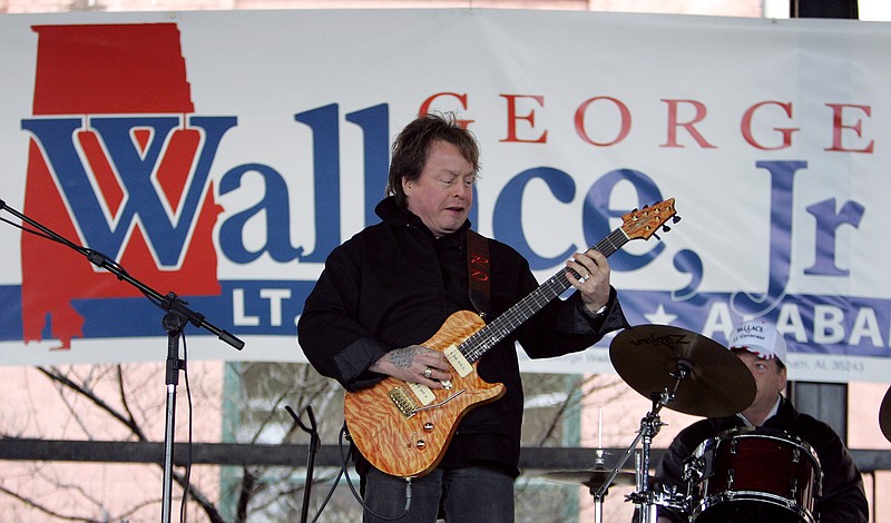 
              FILE - In this Feb. 18, 2006 file photo, Rick Derringer performs during a campaign rally kicking off George Wallace Jr's bid for the office of lieutenant governor in Montgomery, Ala.   Derringer has pleaded guilty, Friday, Feb. 24, 2017, and agreed to pay a $1,000 fine after stepping off a Delta Air Lines flight from Mexico with a loaded handgun in Atlanta’s airport.  (AP Photo/Rob Carr)
            