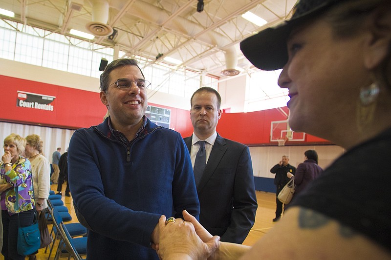 
              U.S Rep. Justin Amash, R-Cascade Township, left, shakes hands with Battle Creek resident Toni Ailene Morris after a town hall meeting on Thursday, Feb. 23, 2017 at the Full Blast Recreation Center in Battle Creek, Mich.   Amash is embracing the town halls that many of his Republican counterparts in Congress have avoided as people lash out at President Donald Trump’s early actions and the planned repeal of the federal health care law.   (Carly Geraci/Kalamazoo Gazette-MLive Media Group via AP)
            