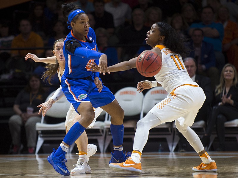 Tennessee's Alexa Middleton, rear back, and Diamond DeShields (11) defends Florida's Felicia Washington (0) during the second half of an NCAA college basketball game in Knoxville, Tenn., Thursday, Feb. 23, 2017. Tennessee won, 74-70. (Brianna Paciorka/Knoxville News Sentinel via AP)