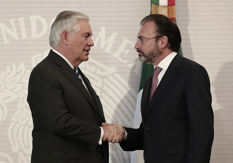 
              U.S. Secretary of State Rex Tillerson, left, shakes hands with Mexico's Foreign Relations Secretary Luis Videgaray at the Foreign Affairs Ministry in Mexico City, Thursday, Feb. 23, 2017. Mexico's mounting unease and resentment over President Donald Trump's immigration crackdown are looming over a Thursday meeting between Tillerson, Homeland Security Secretary John Kelly, and Mexican leaders that the U.S. had hoped would project a strong future for relations between neighbors. (AP Photo/Rebecca Blackwell)
            