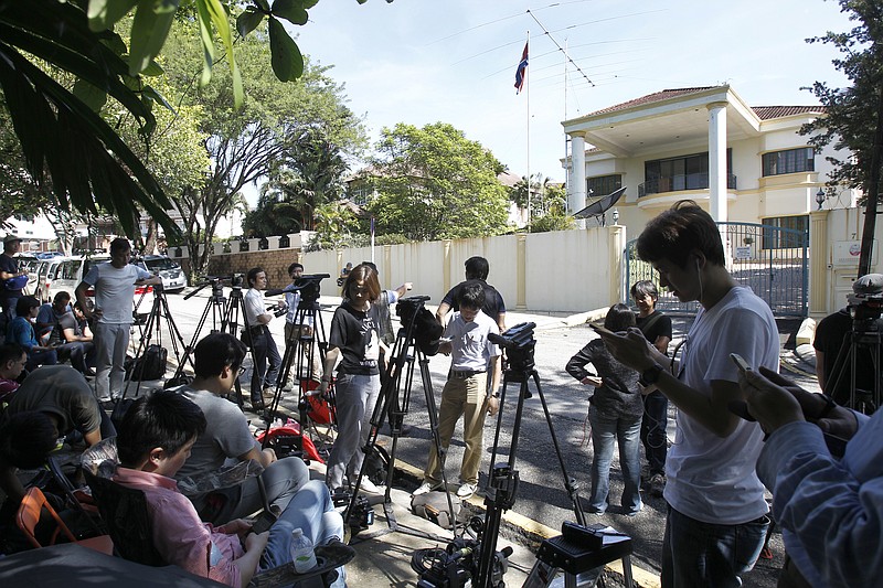 
              Journalists gather in front of North Korean Embassy in Kuala Lumpur, Malaysia, Saturday, Feb. 25, 2017. According to police Friday, forensics stated that the banned chemical weapon VX nerve agent was used to kill Kim Jong Nam, the North Korean ruler's outcast half brother who was poisoned last week at the airport. (AP Photo/Daniel Chan)
            