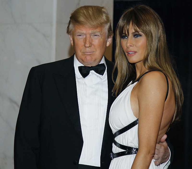 
              FILE - In this April 30, 2011, file photo Donald Trump, left, and Melania Trump arrive for the White House Correspondents Dinner in Washington. President Donald Trump says he won't be attending the annual White House Correspondents' Association dinner this spring. In a tweet on Saturday, Feb. 25, 2017, the president doesn't give a reason but says he wishes "everyone well and have a great evening!" The annual fundraiser for college scholarships mixes politicians, journalists and celebrities. (AP Photo/Alex Brandon, File)
            