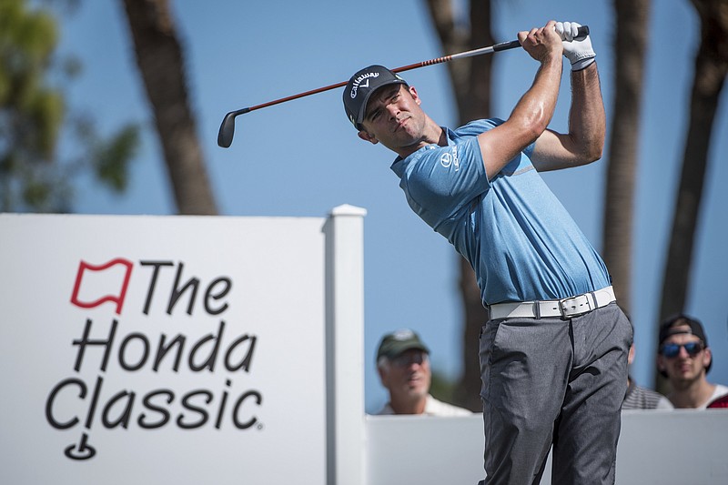 
              Golfer Wesley Bryan tees off on the fourth hole during the Honda Classic golf tournament in Palm Beach Gardens, Fla., on Friday, Feb. 24, 2017. (Michael Ares/The Palm Beach Post via AP)
            