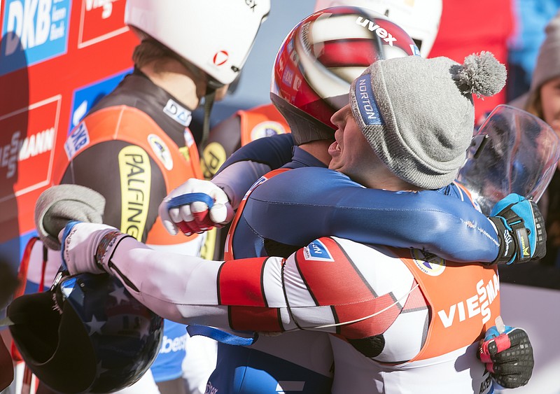 
              Matt Mortensen, right, and Jayson Terdiman, left, of the US celebrate their second place during the doubles luge World Cup race in Altenberg, eastern Germany, Saturday, Feb. 25, 2017. (AP Photo/Jens Meyer)
            